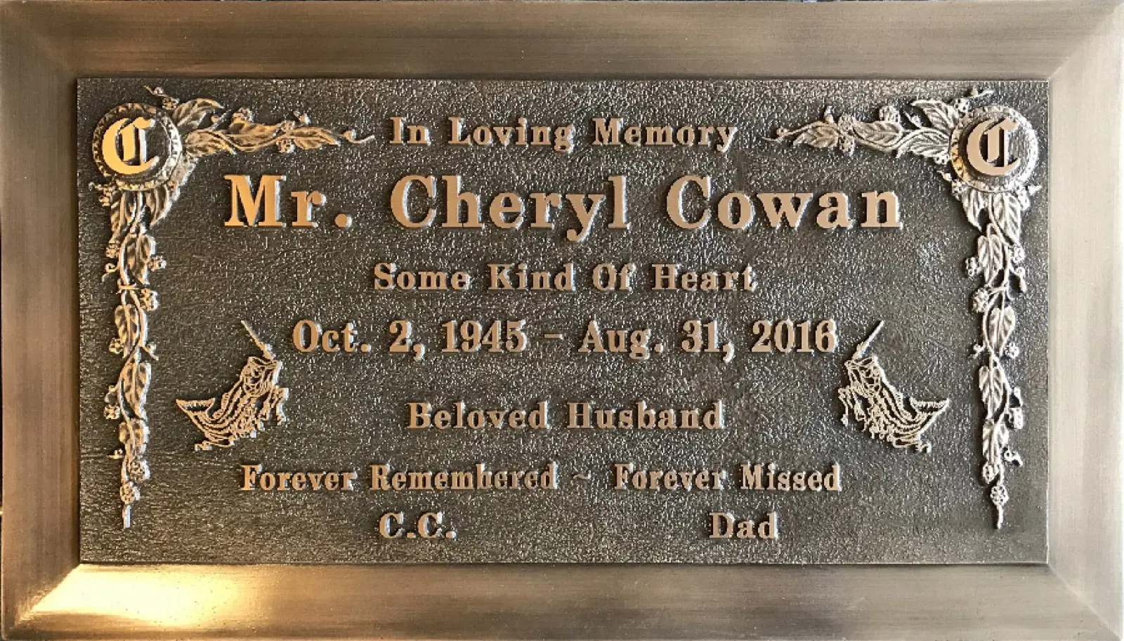 Finished 28 by 16 inch bronze memorial marker with raised lettering and decorative border
