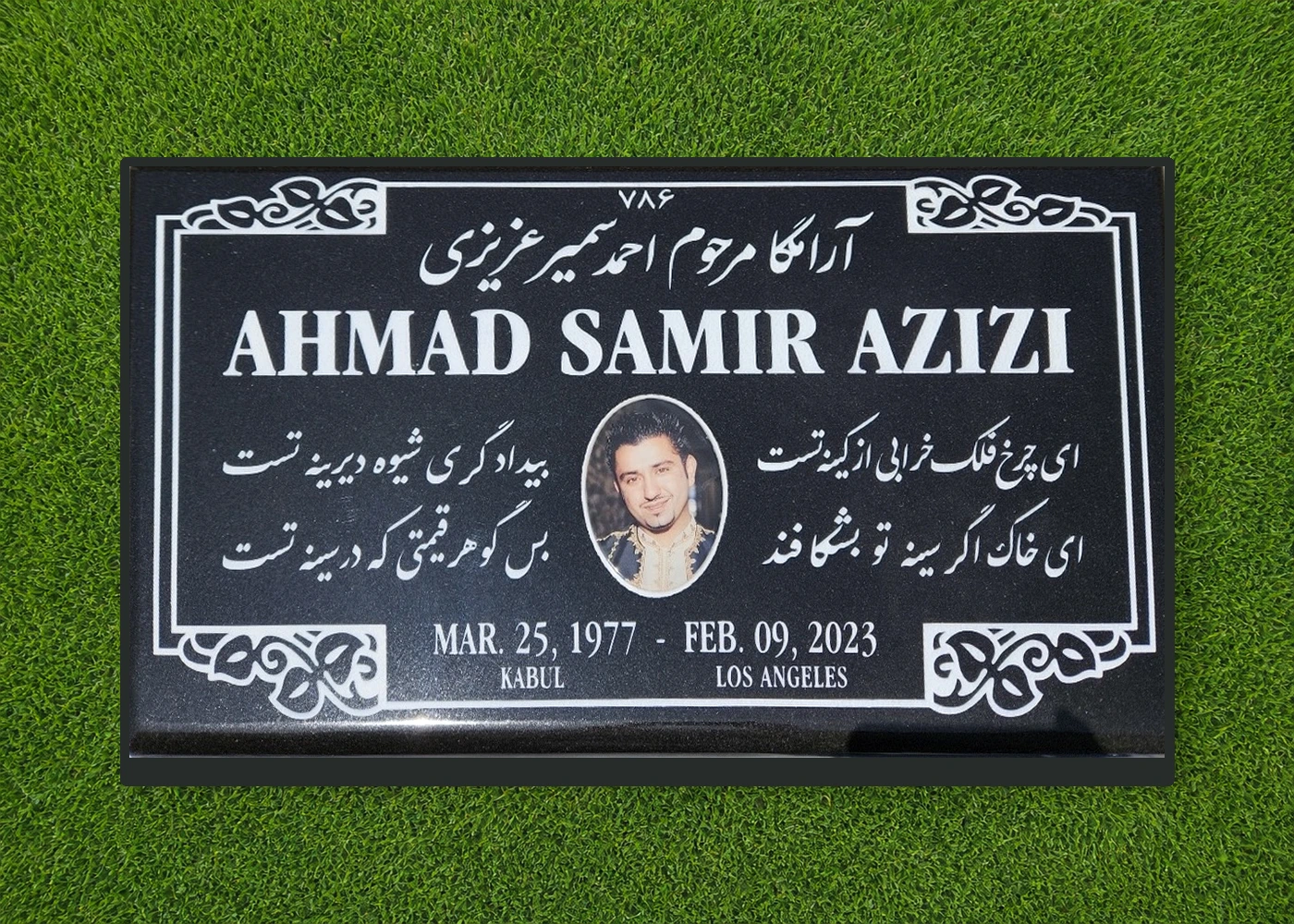 Black granite 28 by 16 inch flat marker with portrait and Persian lettering