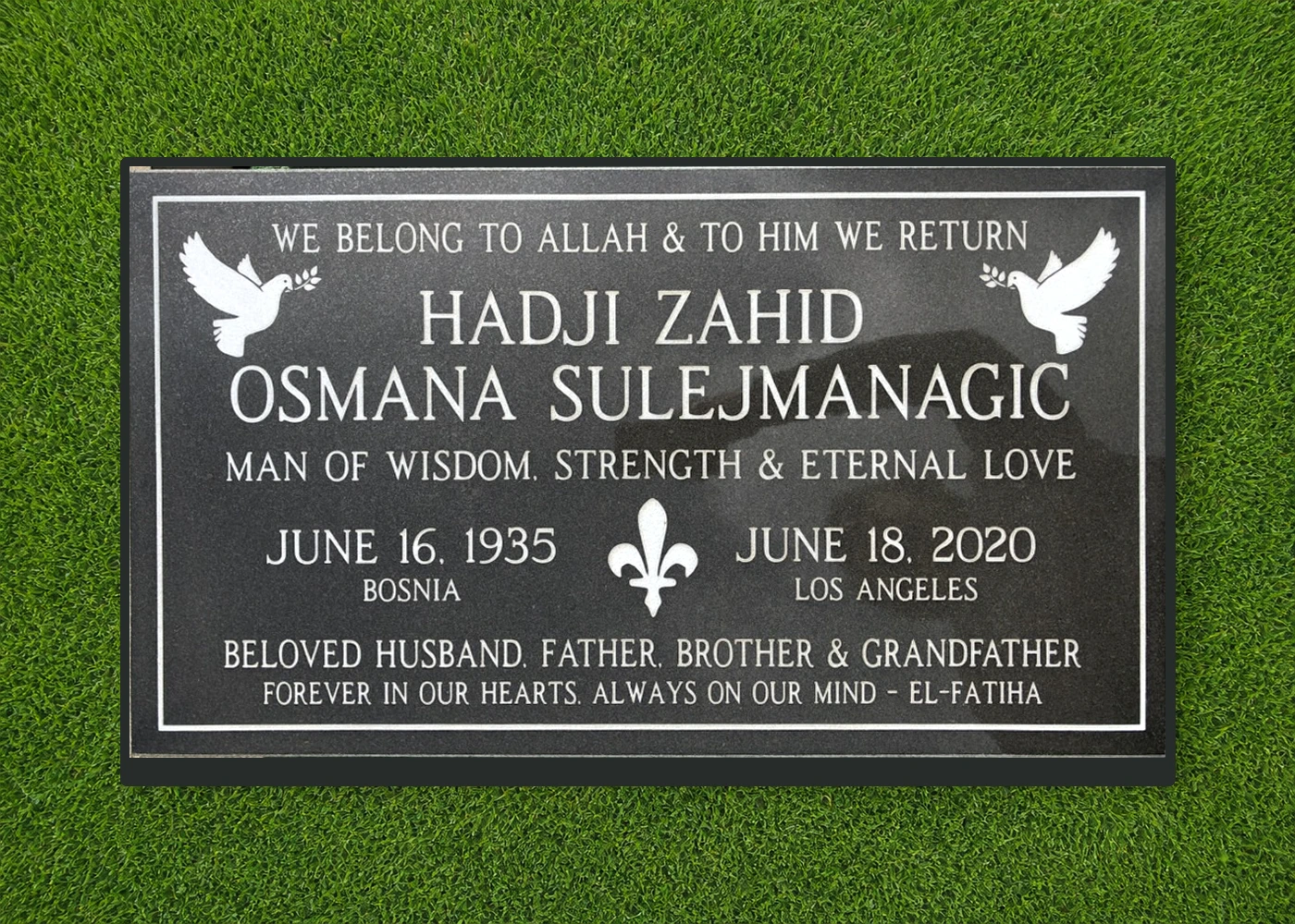 Black granite 28 by 16 inch Islamic flat marker with dove artwork