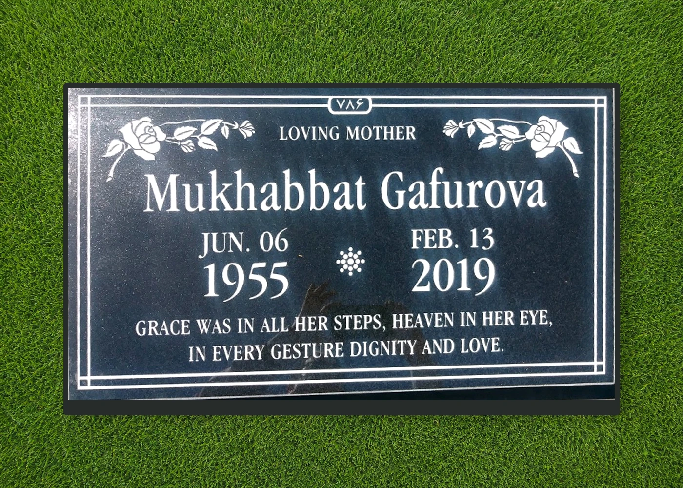 Black granite 28 by 16 inch flat marker with rose border