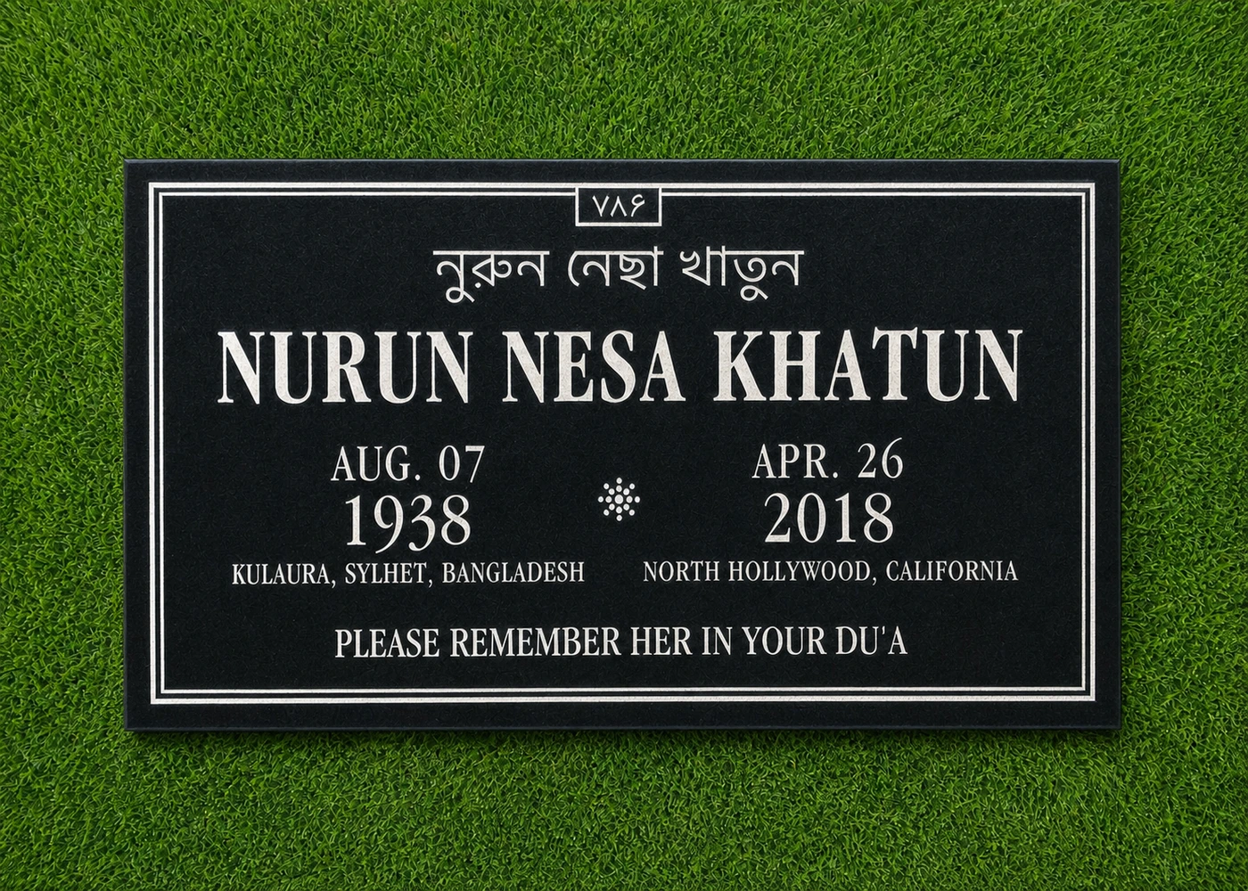 Black granite 28 by 16 inch marker with Bengali and English inscriptions