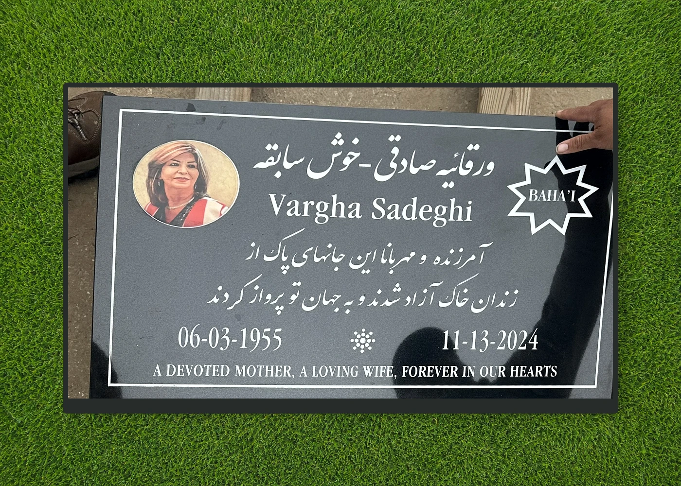 Black granite 28 by 16 inch Bahá’í marker with portrait and Persian inscription