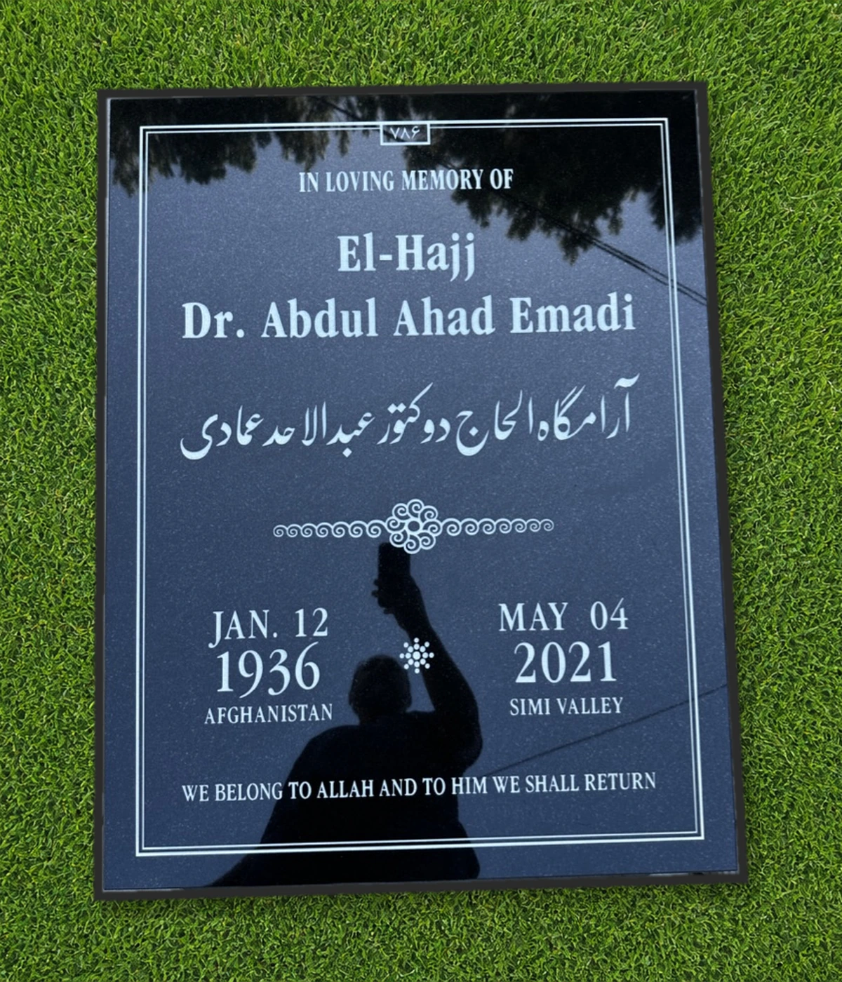 Black granite 39 by 30 inch half ledger with English and Persian inscriptions