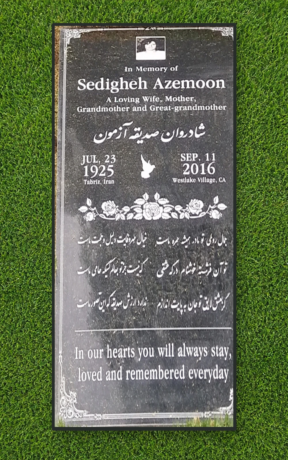 Black granite 72 by 32 inch companion ledger with portrait, roses, and multilingual text