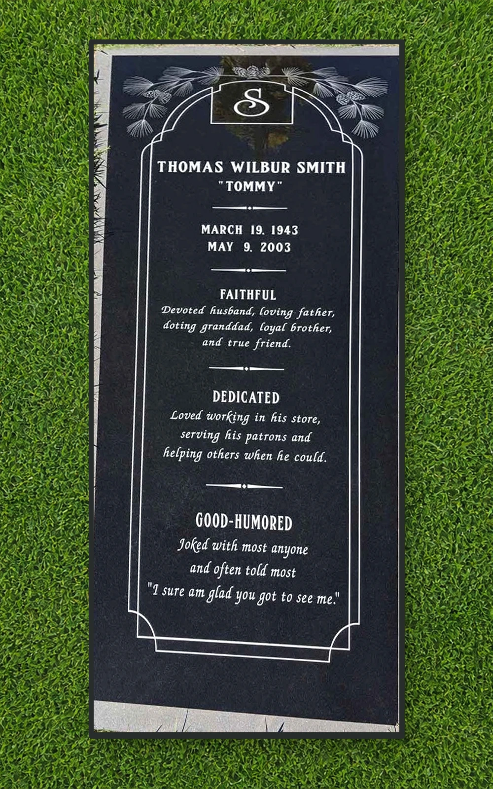 Black granite 72 by 32 inch full ledger with pine artwork and detailed life story
